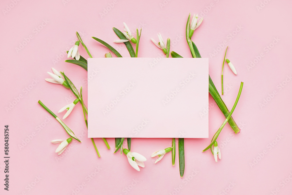 Beautiful snowdrops and blank greeting card on pink background Beautiful snowdrops and blank greeting card on pink background
