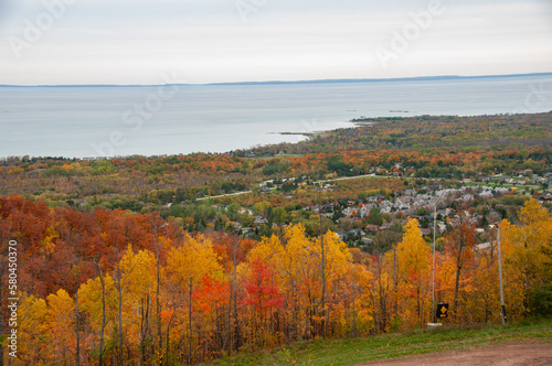 Blue mountain ski hill runs with the town of Collingwood and Georgian Bay in the background during autumn