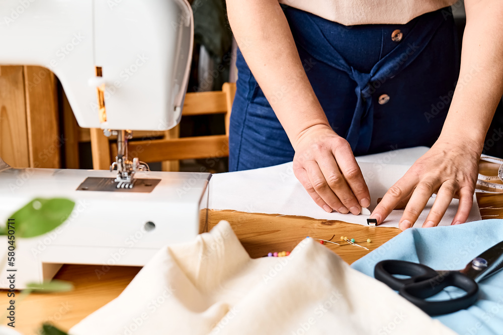 Young Dressmaker Woman Sews Clothes on Sewing Machine. the Tailor Creates a  Collection of Outfits Stock Image - Image of creative, industry: 159993583