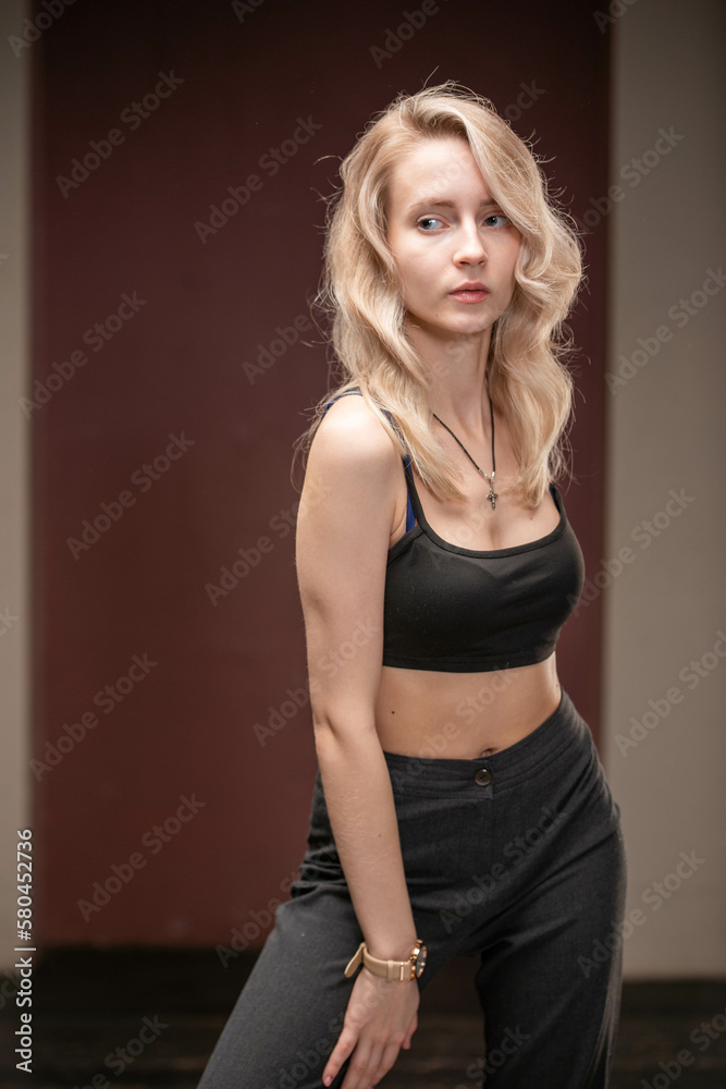 blonde in black suit