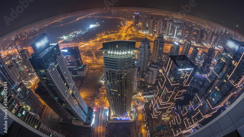Photography Panorama of Dubai Marina with JLT skyscrapers and golf course night to day timelapse, Dubai, United Arab Emirates