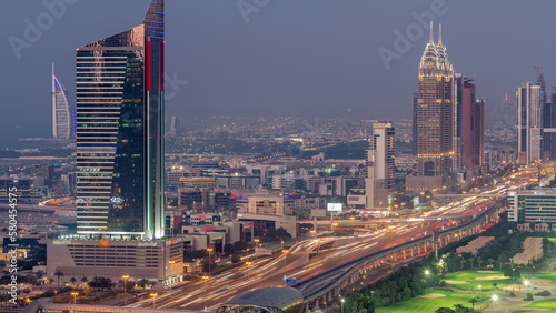 Aerial view of Sheikh Zayed Road in Dubai Internet City area day to night timelapse