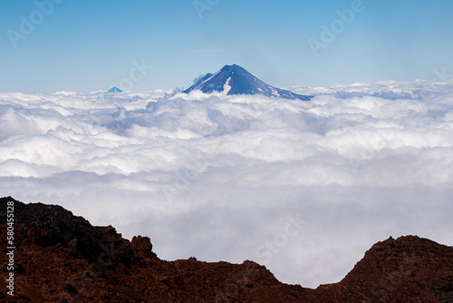 Vista del volcán Llaima entre las Nubes desde la cumbre del volcán Lonquimay, region de la Araucanía, Chile photo