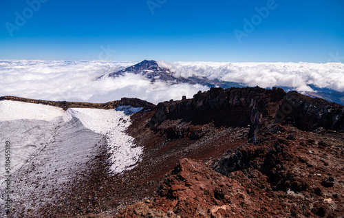 Vista del volcán Tolhuaca entre las Nubes desde la cumbre del volcán Lonquimay, region de la Araucanía, Chile photo