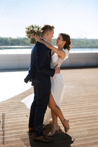bride and groom first meeting on the roof of skyscraper