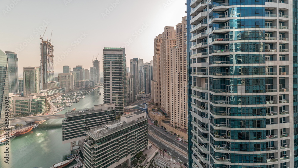 Panorama showing overview to JBR and Dubai Marina skyline with modern high rise skyscrapers waterfront living apartments aerial timelapse - obrazy, fototapety, plakaty 