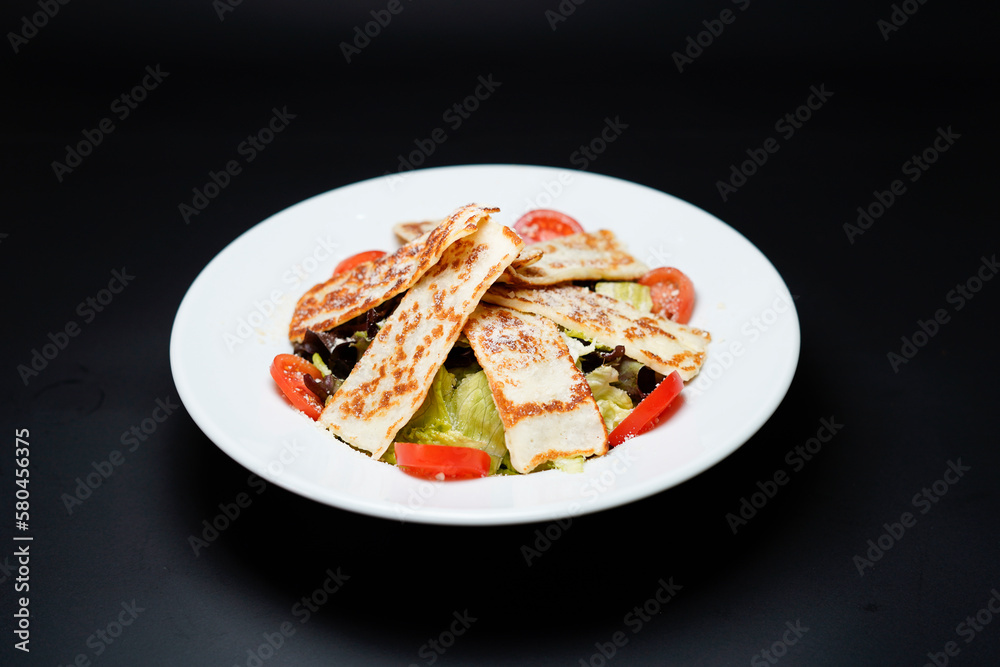 Hellim Salad isolated on black background