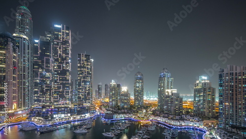 Luxury yacht bay in the city aerial night timelapse in Dubai marina © neiezhmakov
