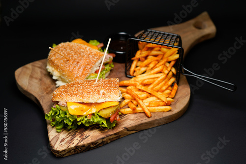 Sandwich with Fries isolated on black background