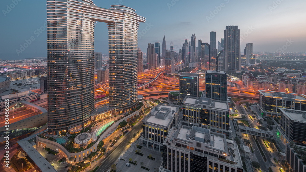 Obraz premium Futuristic Dubai Downtown and finansial district skyline aerial night to day timelapse.