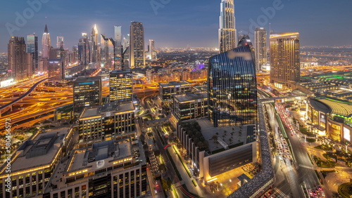 Futuristic Dubai Downtown and finansial district skyline aerial day to night timelapse. © neiezhmakov