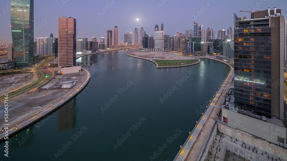 Cityscape of skyscrapers in Dubai Business Bay with water canal aerial night to day timelapse Cityscape of skyscrapers in Dubai Business Bay with water canal aerial night to day timelapse