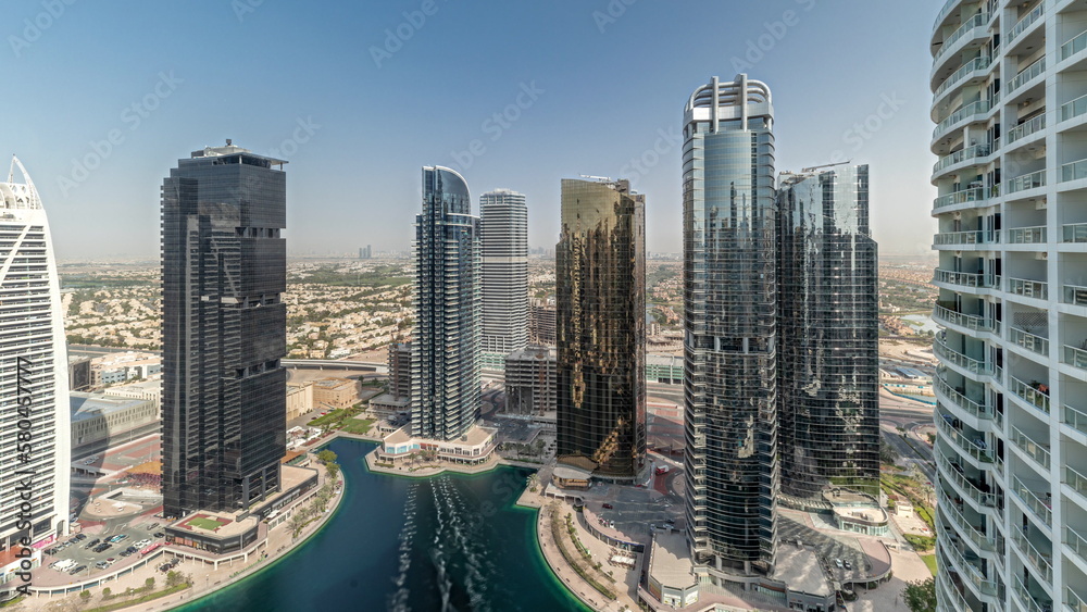 Obraz premium Panorama showing tall residential buildings at JLT aerial timelapse, part of the Dubai multi commodities centre mixed-use district.