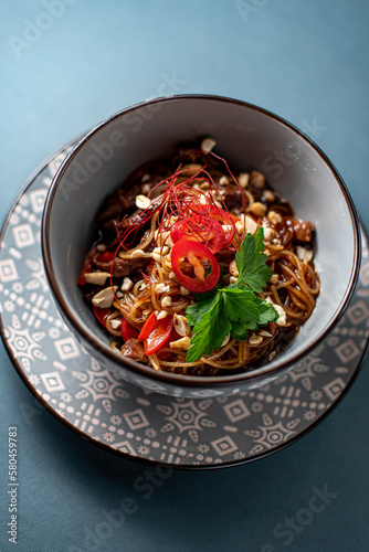 bowl red chili with noodles
