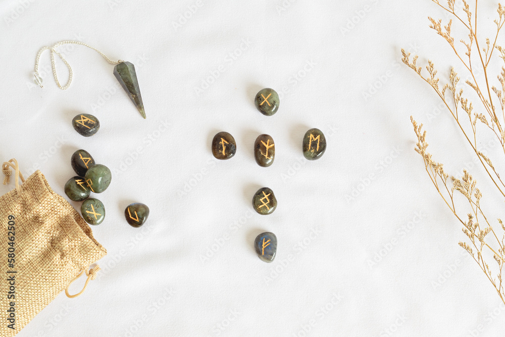 Set of rune stones for divination and fortune telling. Mystic still life with labradorite runes. Esoteric, occult , witchcraft rituals idea Set of rune stones for divination and fortune telling. Mystic still life with labradorite runes. Esoteric, occult , witchcraft rituals idea