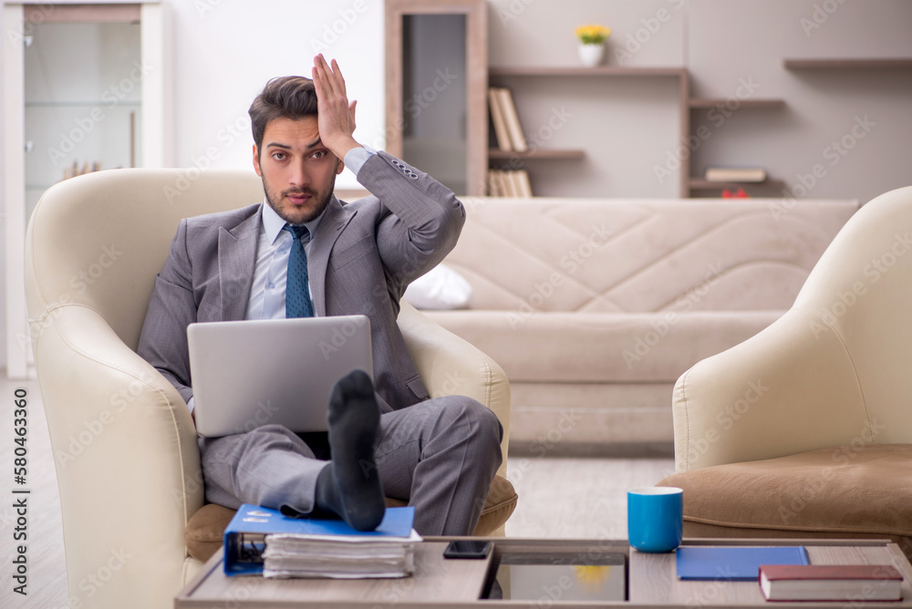 Young male employee working from home Young male employee working from home