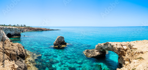 Love bridge near Ayia Napa in Cyprus. Natural rock arch formation known as Bridge of Lovers at Cape Greco. Sea caves on coastline between Agia Napa and Cavo Greco National park