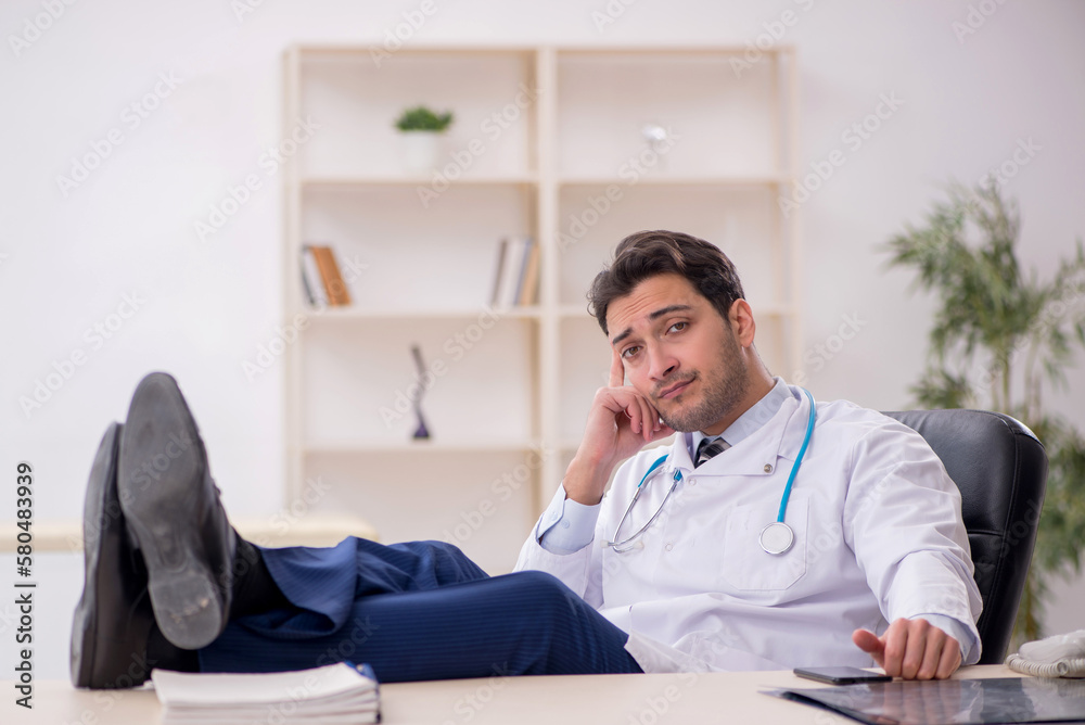 Young male doctor working in the clinic Young male doctor working in the clinic