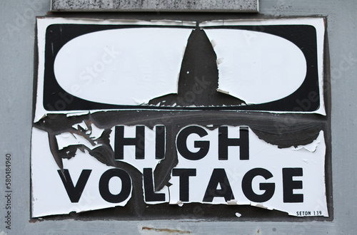 High voltage danger sign on wall for caution and security symbolizing warning dangerous zone © Your Hand Please