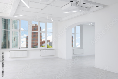 Empty room with white walls and beautiful windows during repair