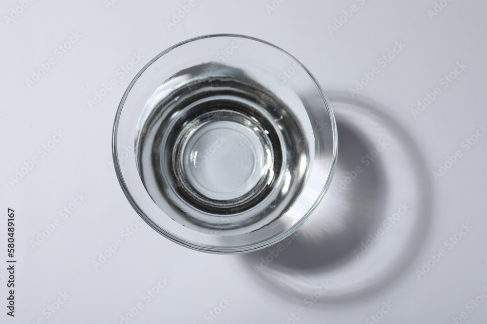 Glass bowl with water on white background, top view Glass bowl with water on white background, top view
