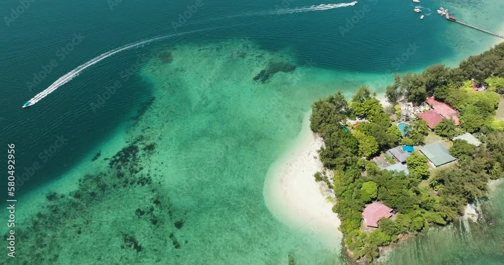 Aerial view of Manukan island with a beautiful sandy beach. Tunku Abdul Rahman National Park. Kota Kinabalu, Sabah, Malaysia.