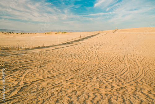 Sand dunes and Tire tracks on sand, Oceano, California