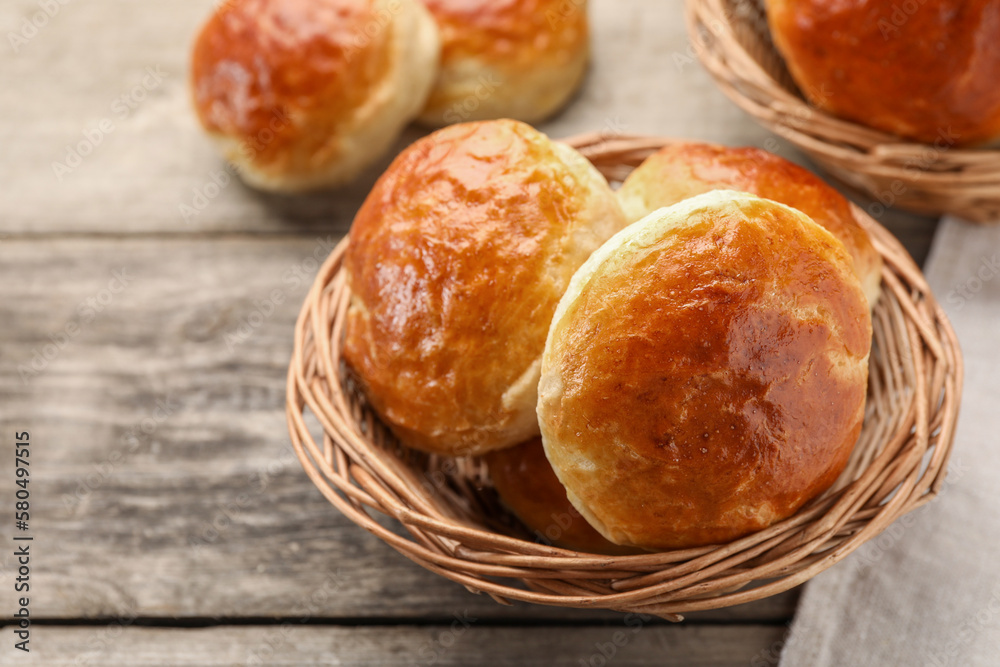 Freshly baked soda water scones on wooden table, closeup