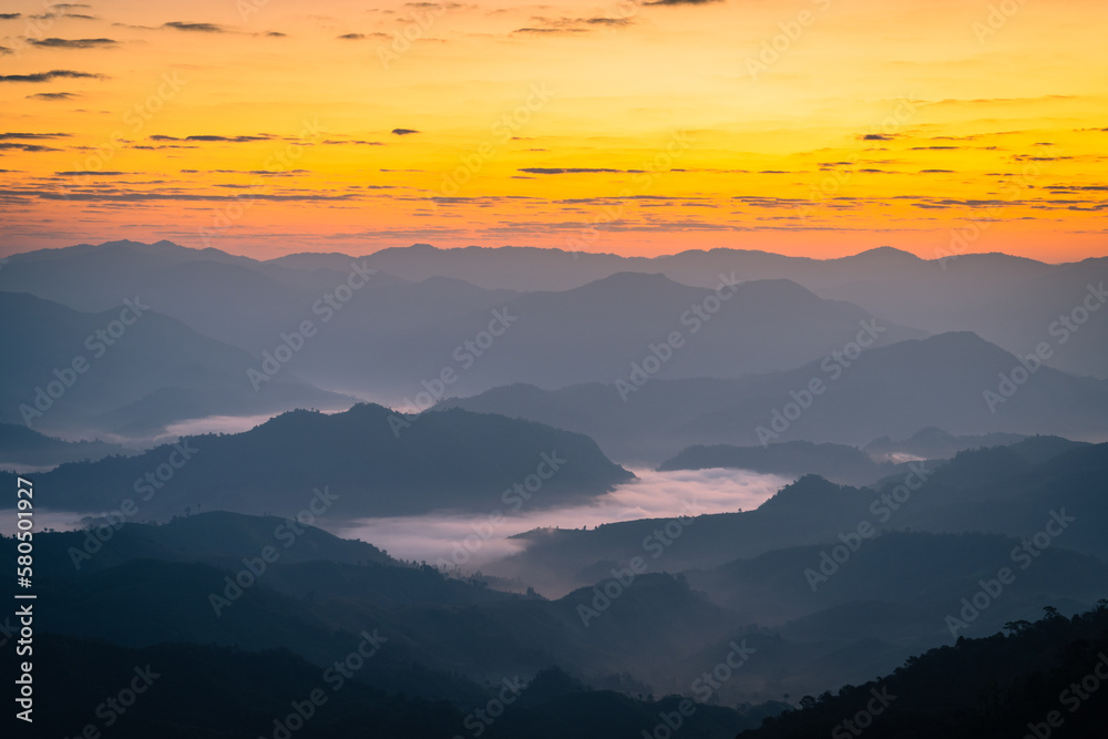 The sunrise over the mountain with sea of fog in the western of Thailand (Tha Song Yang District, Tak province)