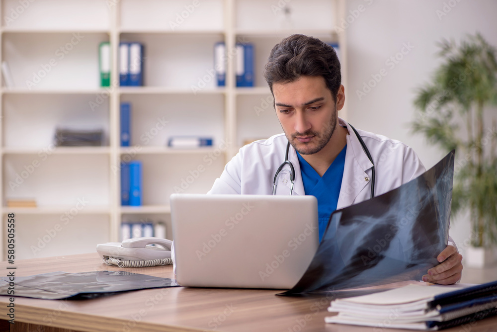 Young male doctor radiologist working in the clinic Young male doctor radiologist working in the clinic