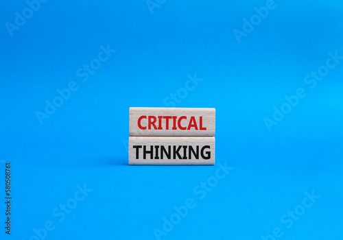 Critical thinking symbol. Wooden blocks with words Critical thinking. Beautiful blue background. Business and Critical thinking concept. Copy space.
