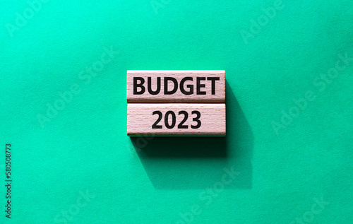 Budget 2023 symbol. Wooden blocks with words Budget 2023. Beautiful green background. Business and Budget 2023 concept. Copy space.