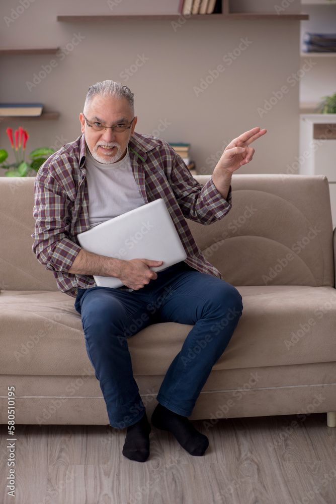 Old man working from home during pandemic Old man working from home during pandemic