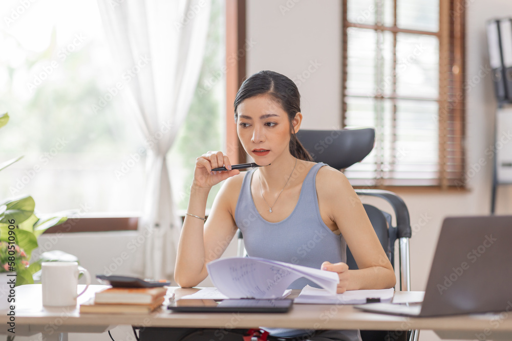 Portrait woman of smiling Happy Young Asian female freelancer working at home, Asian finance accounting office concept. Portrait woman of smiling Happy Young Asian female freelancer working at home, Asian finance accounting office concept.