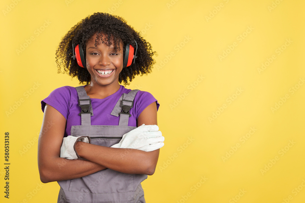Cool afro female carpenter in work uniform Cool afro female carpenter in work uniform