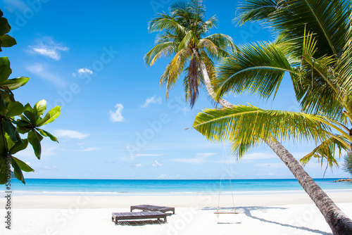 Fototapeta Naklejka Na Ścianę i Meble -  beach landscape background for summer travel with sun, coconut tree on white sand beach with beautiful blue sea and sky