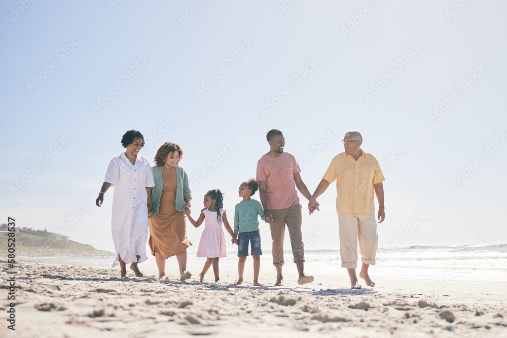 Grandparents, parents and children walking on beach holding hands for love, support and quality time together. Travel, happy and kids with big family by ocean for holiday, summer vacation and weekend