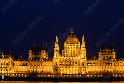 Budapest parliament illuminated at night and Danube river, Hungary © erika8213