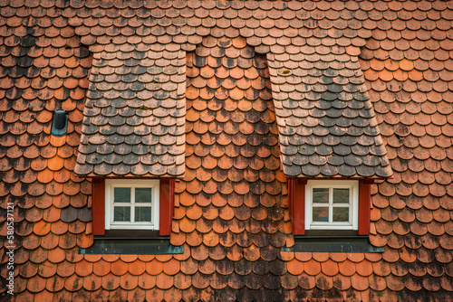 old roof and windows of a medieval house in noerdlingen photo