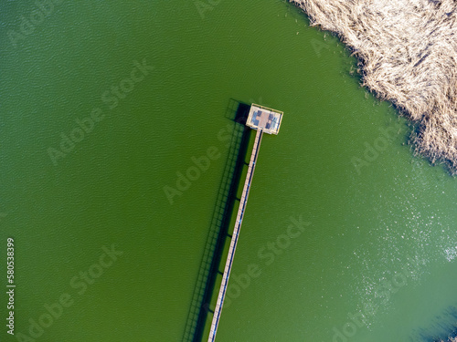 Aerial view landscape. View of water, lake, pond. Photo from a drone. Footbridge, pier.