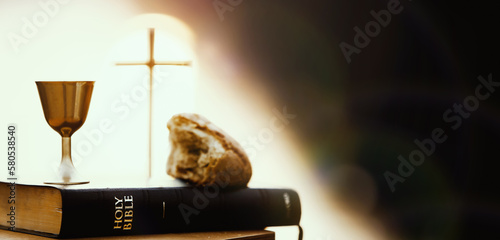 Фотография Holy Communion last supper bread and wine and bible book symbolizing the holy bl