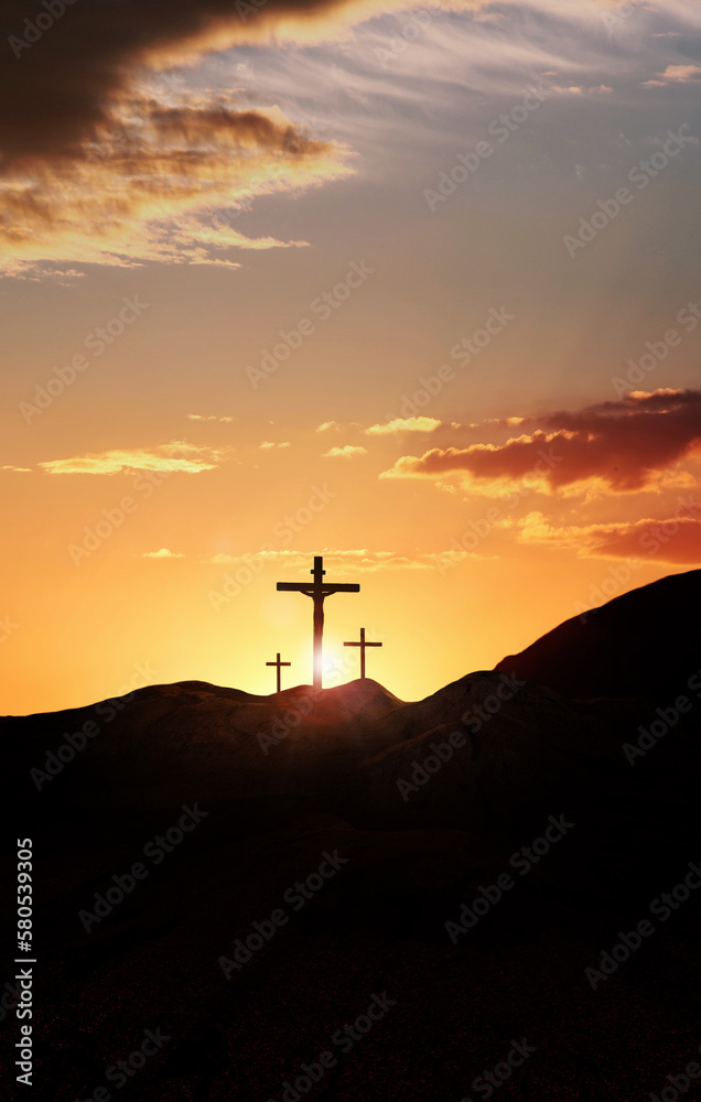 Passion Week cross on a hill symbolizing the sacrifice, suffering, death, resurrection and passion of Jesus against a bright sunset light background
