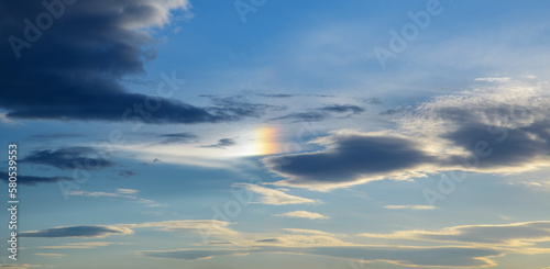 Dramatic blue sky with white clouds.