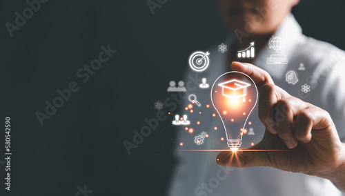Female holding lightbulb showing graduation hat, Internet education course degree, study knowledge to creative thinking idea and solving solution. E-learning graduate certificate program concept.