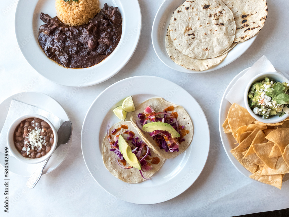 Overhead view of food served in plates on table Overhead view of food served in plates on table