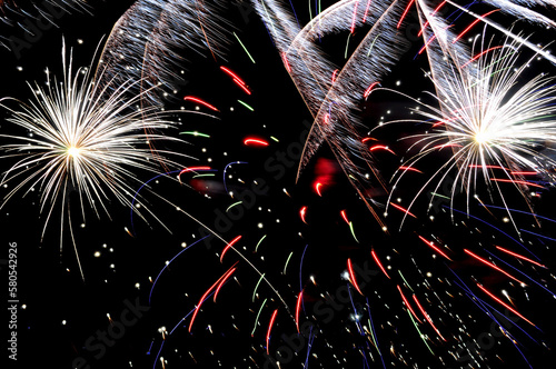 Low angle view of fireworks against sky photo