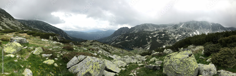 Panoramic view of mountains against cloudy sky at Retezat National Park Panoramic view of mountains against cloudy sky at Retezat National Park