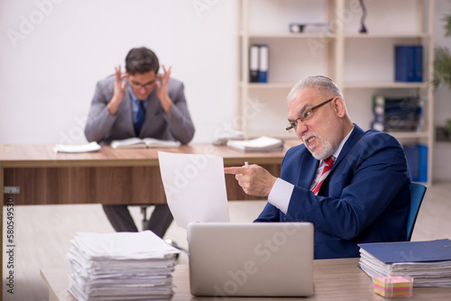 Two male colleagues sitting in the office