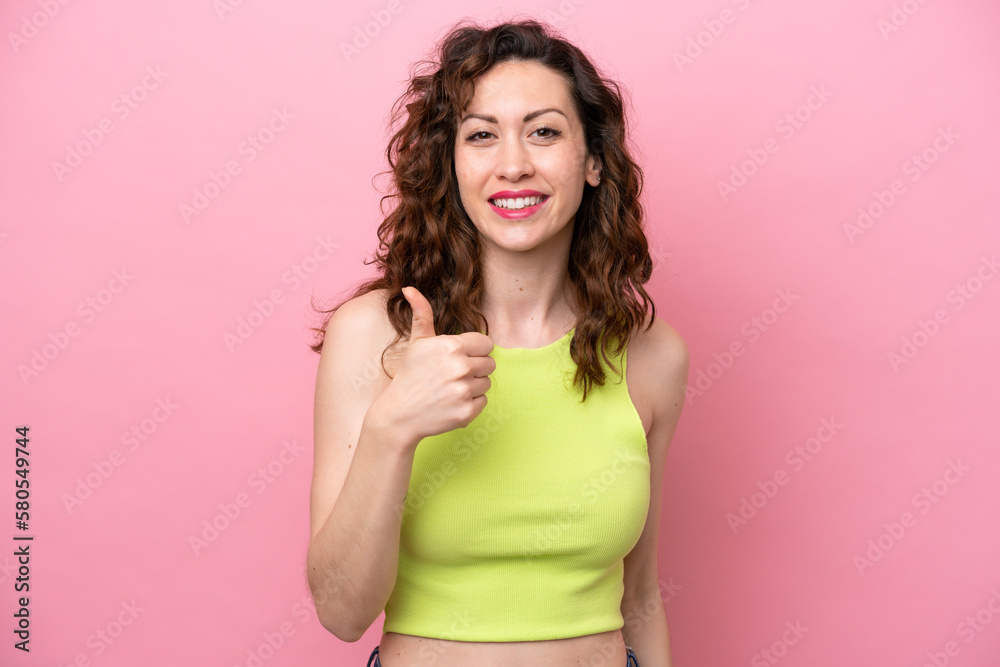 Young caucasian woman isolated on pink background giving a thumbs up gesture Young caucasian woman isolated on pink background giving a thumbs up gesture