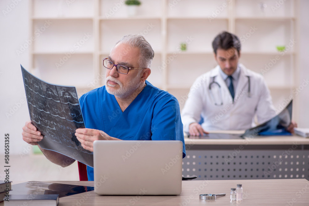 Two male doctors radiologists working in the clinic Two male doctors radiologists working in the clinic